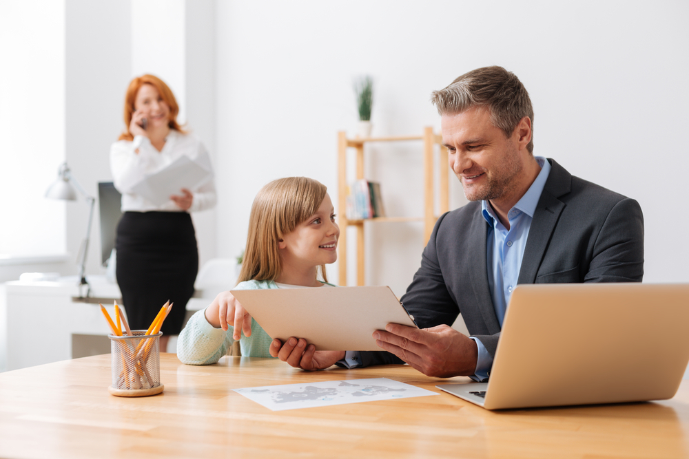 intelligent admirable girl learning about dads work