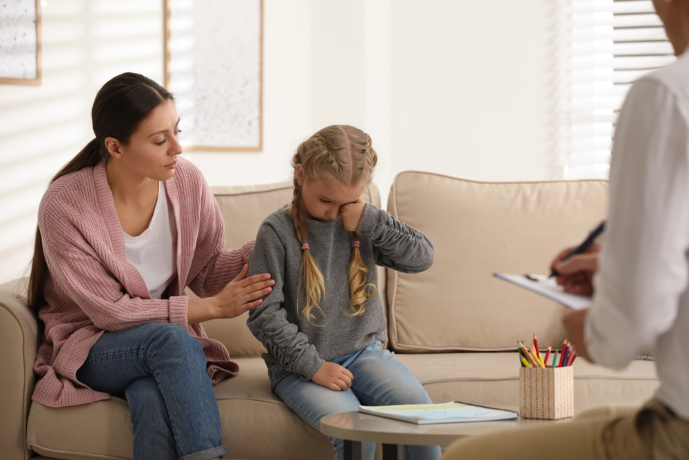 little girl and her mother on appointment with child