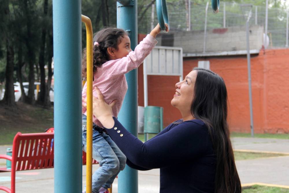 Divorced single mother plays with her 4 year old Latina daughter