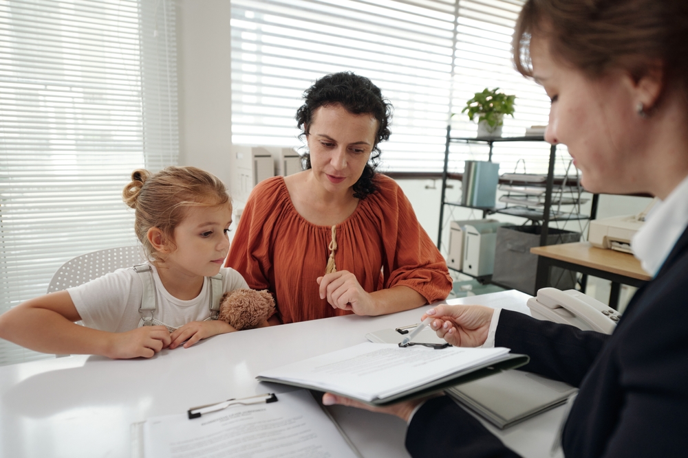 Social Worker Discussing Adoption Document With Woman